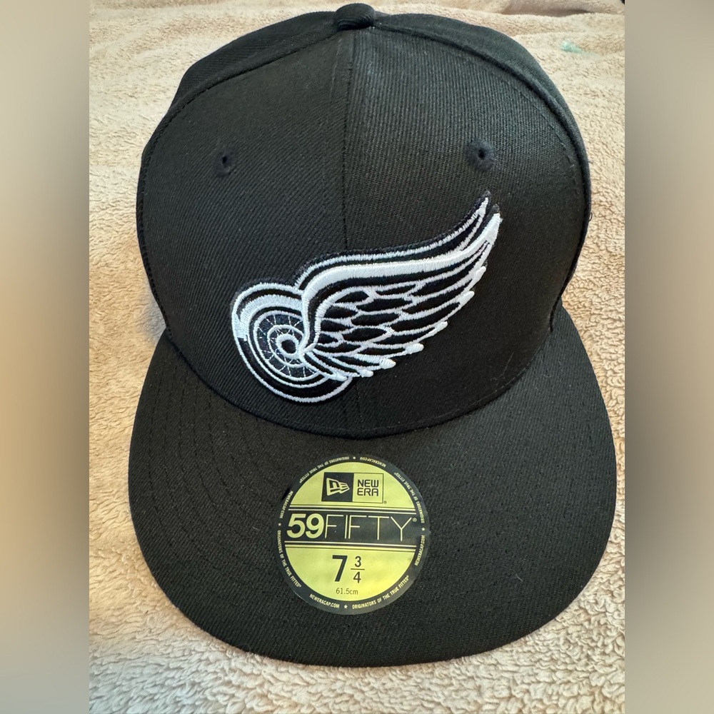 New Era Black Cap with White Wing Design